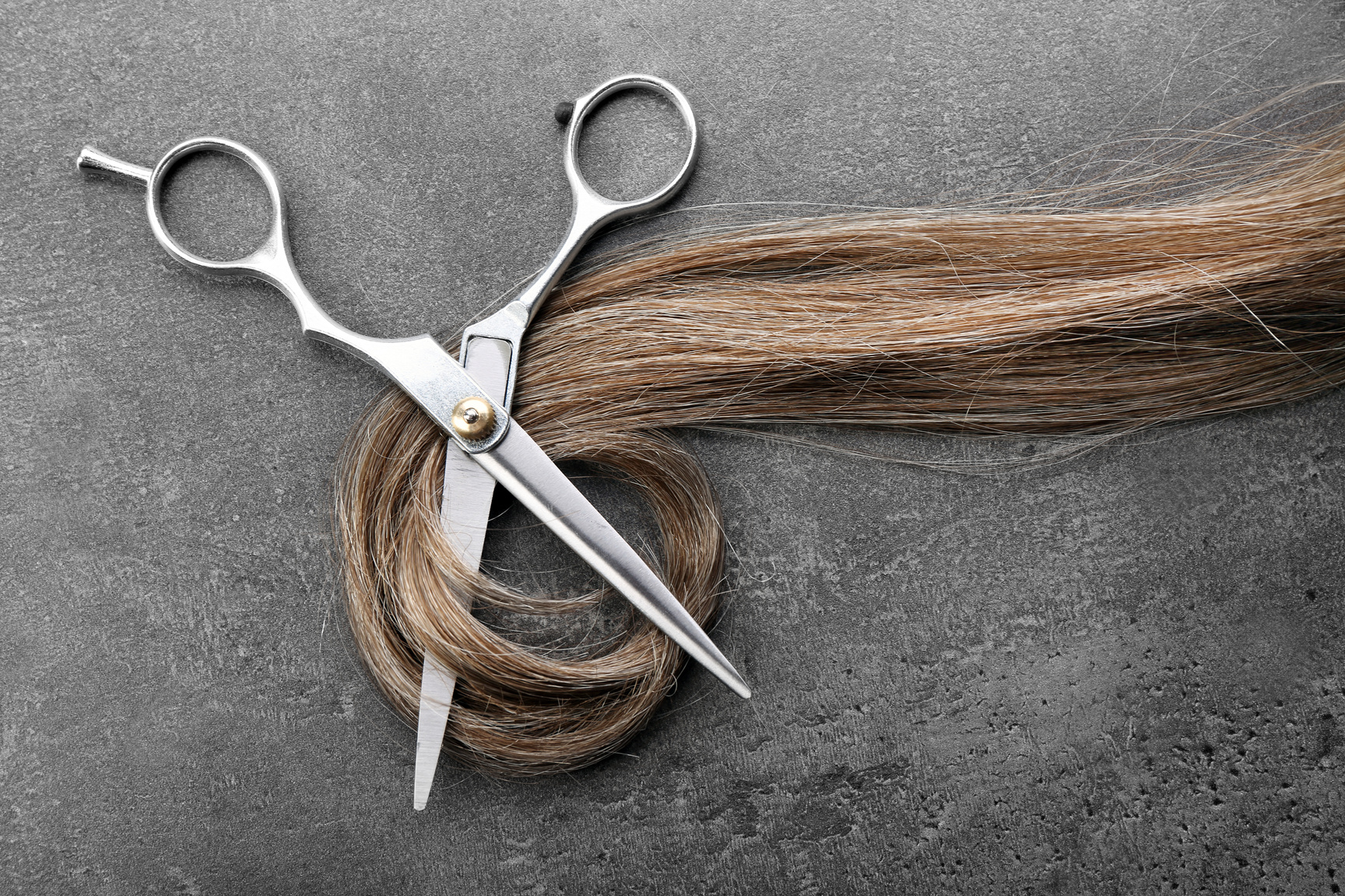 Hairdresser's Scissors with Strand of Brown Hair 